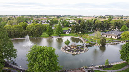 Drone photo over Greenfield park and water 