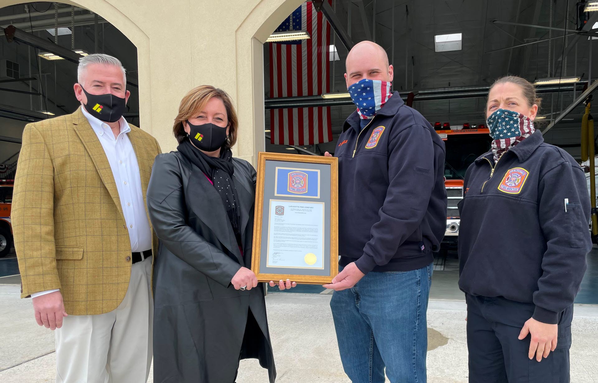Lafayette Fire Company acknowledged High Companies' years of support with a commemorative plaque. From left to right: Mike Lorelli, Senior V.P. - Commercial Asset Management, High Associates, Ltd.; Robin Stauffer, Assistant Secretary and Executive Director of High Foundation; Jason Beiler, President, and Suzi Sutton, Community Outreach Coordinator, Lafayette Fire Company.